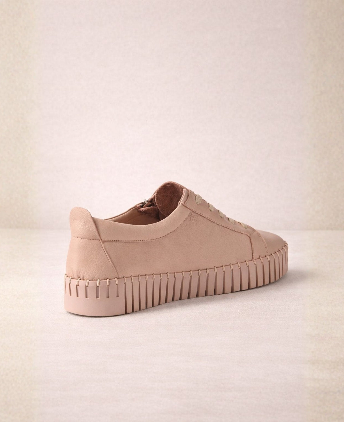 Back view of Bump Rose Leather Sneakers highlighting leather construction, pull tab detail and raised platform cleated sole