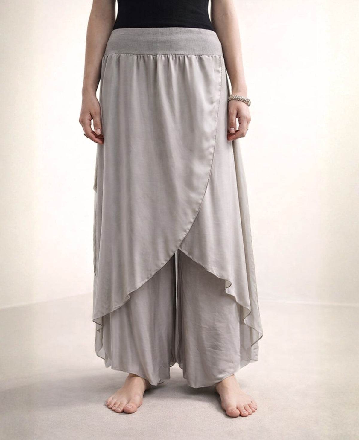 Detailed front view of the mocka Celine Silk Blend Boho Pants, highlighting the elegant flow of silk blend fabric and stylish ribbed elastic waist.