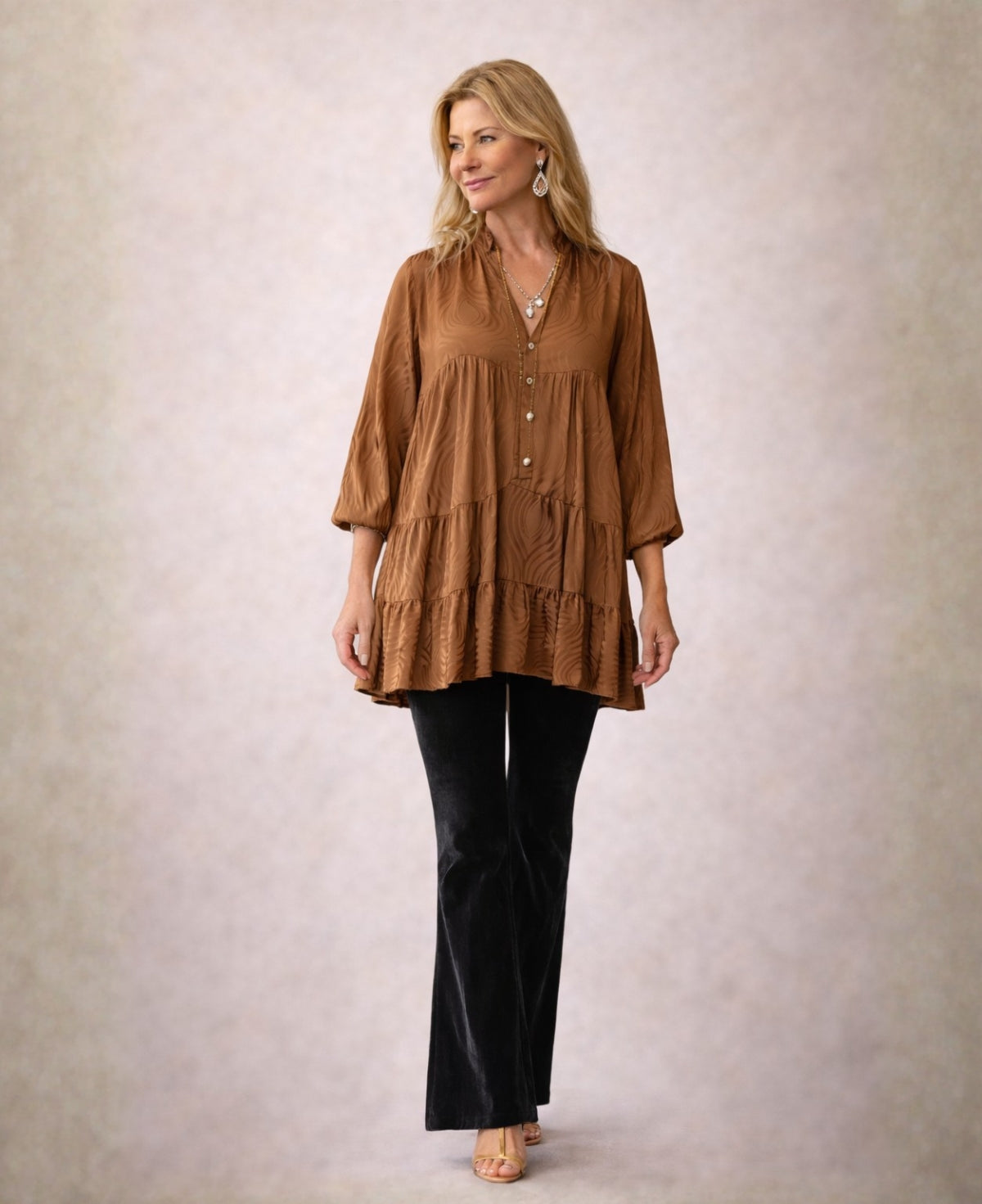 Copper Eden Pattern satin top styled with velvet flared pants, showcasing embossed satin texture and elegant drape.