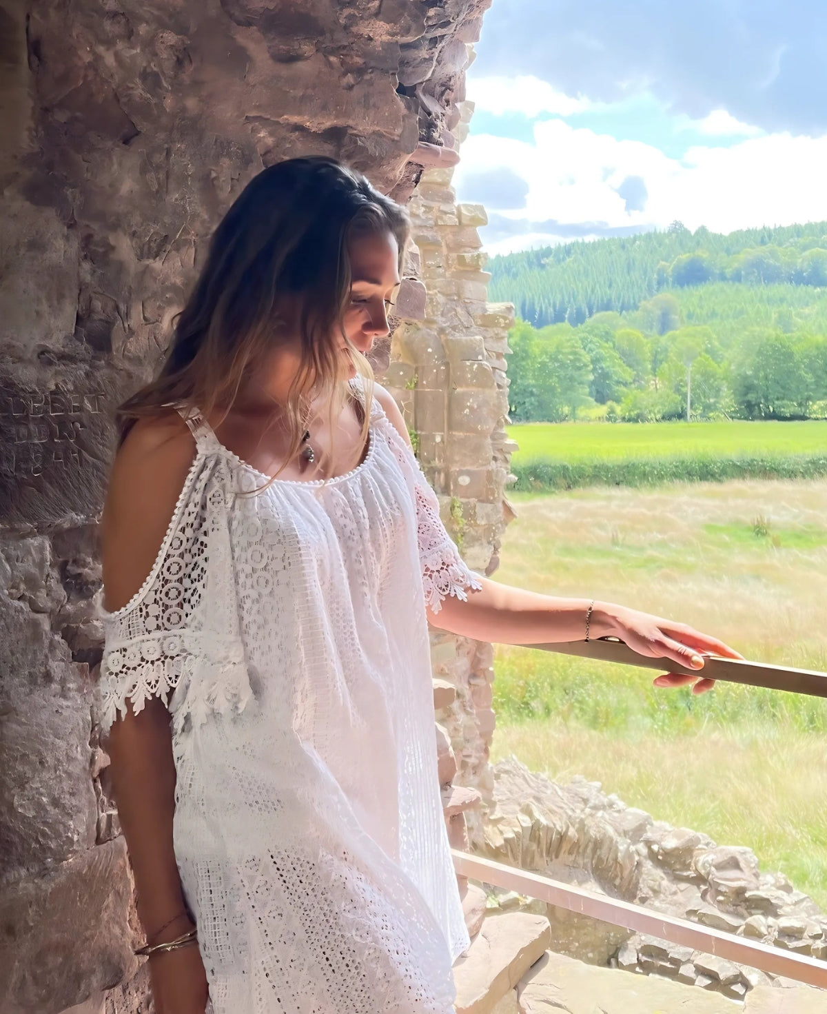 Beautiful white lace top designed with vintage floral accents and a lightweight, breathable feel.