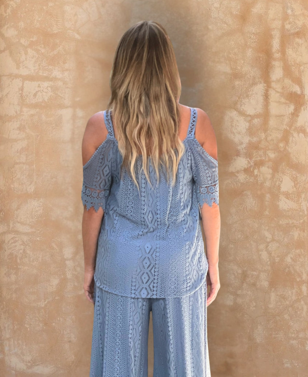 Back view of the jeans Louella Lace Top, showcasing intricate lace details and a relaxed, flowy fit.