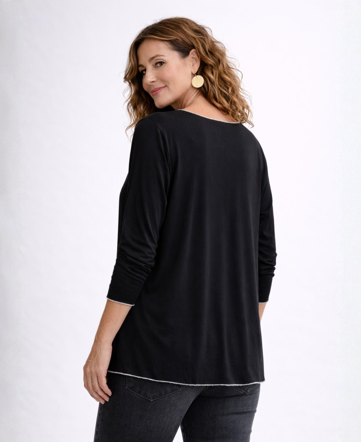 Back angled view of black Maree long sleeve viscose jersey top showing straight hem and loose drape