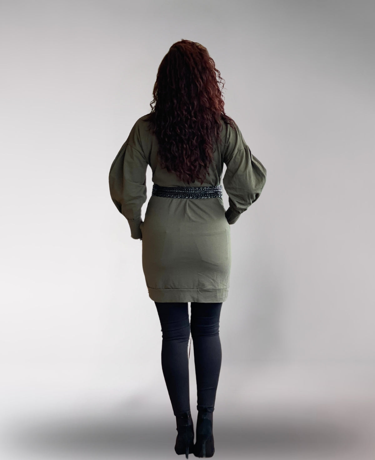 Back view of khaki belted sweater coat, showcasing tailored cuffs and graceful longline design.