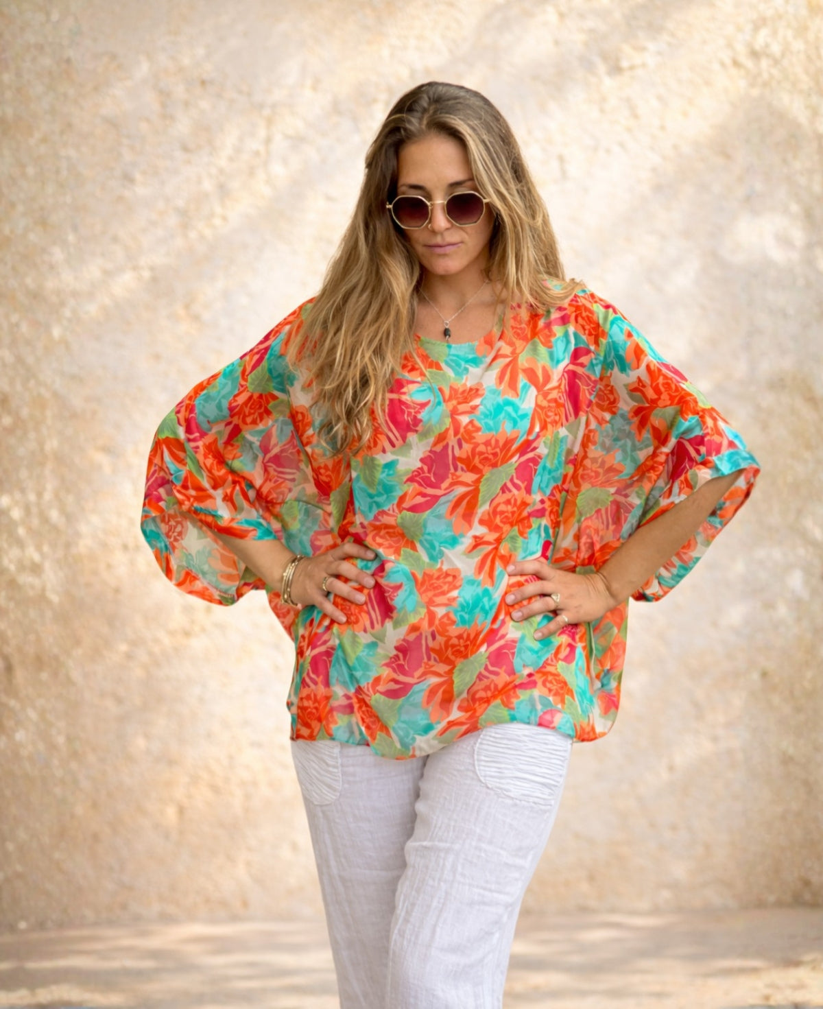Front detail of the Roses Silk Top in rose floral print showing the loose batwing sleeves and relaxed silk drape.