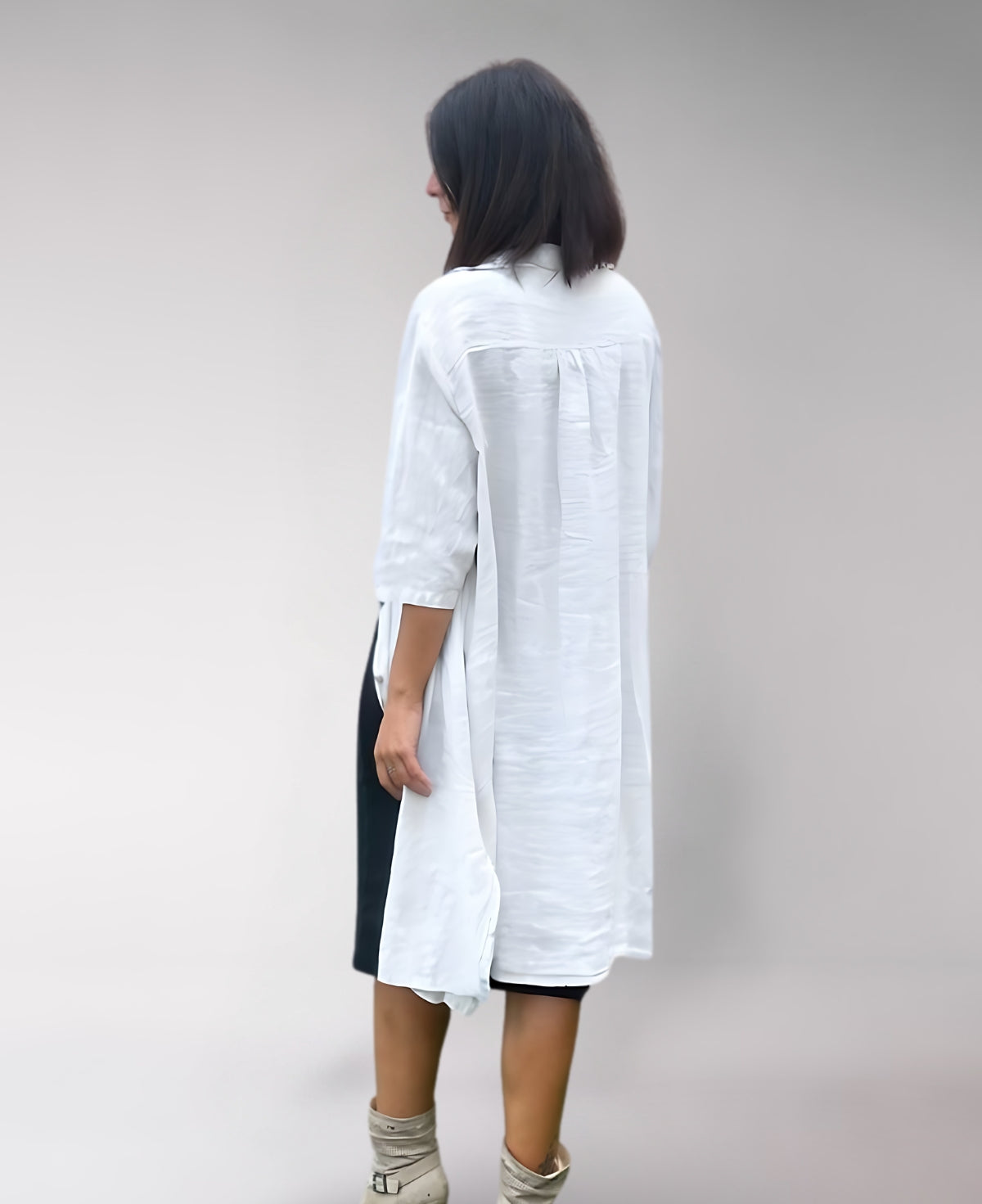 White Samira Linen Shirt Dress crafted from premium linen, featuring a timeless button-down design and relaxed fit for cool, comfortable style.