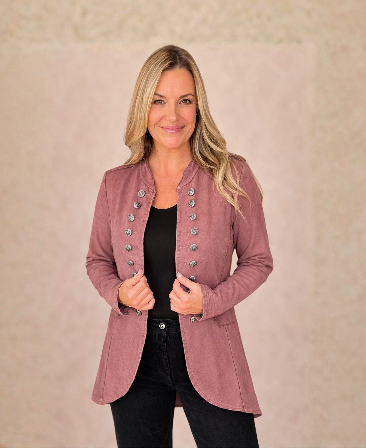 Front view of the Sergeant Pepper Jacket in wine featuring military buttons, stand collar and fitted stretch waxed cotton silhouette.