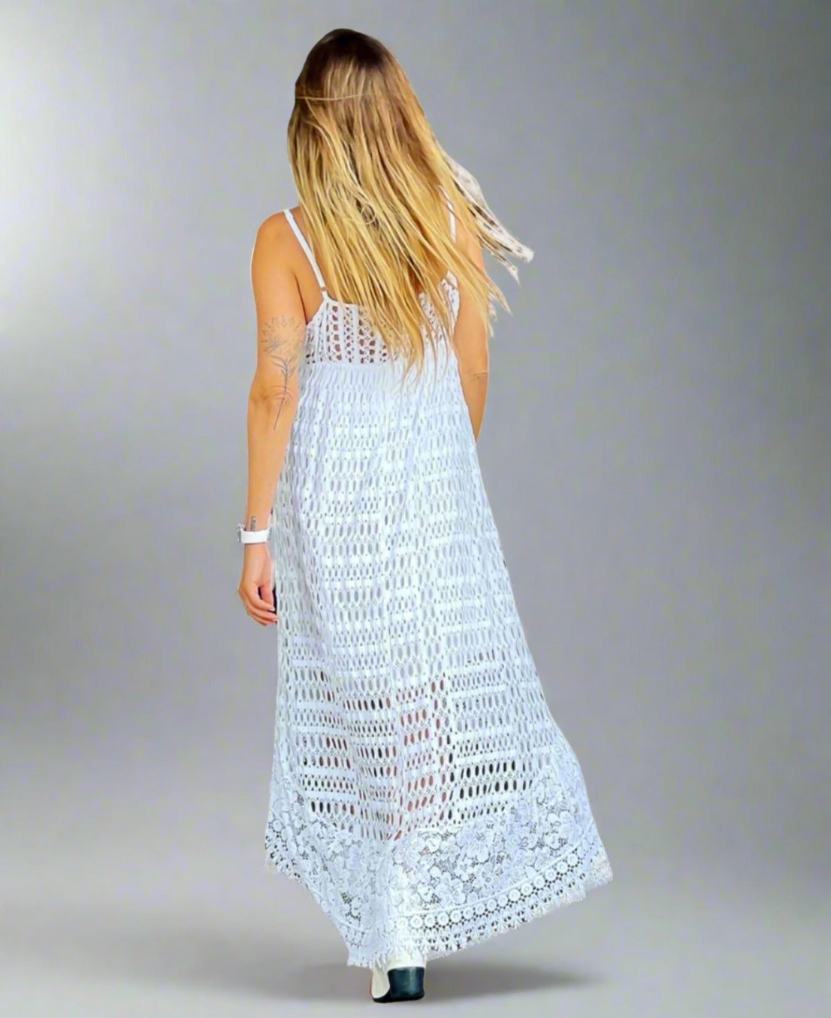 Back view of the white Sirena Dress, showcasing its luxurious stretch cotton eyelet fabric and detailed lace trim, exuding enchanting mermaid vibes.