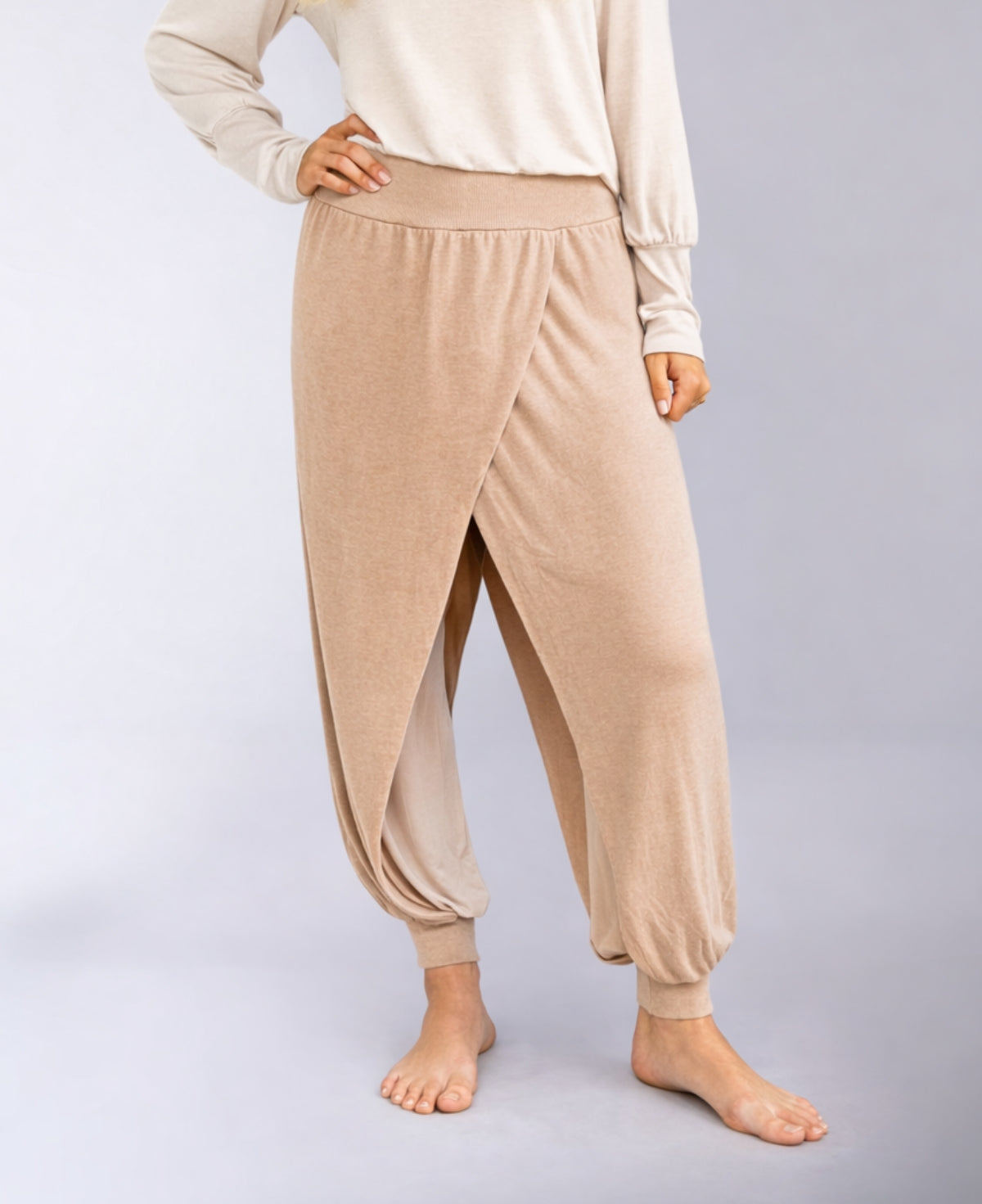 light camel aladina knit harem pants showing layered crossover detail and soft cotton lining with barefoot styling