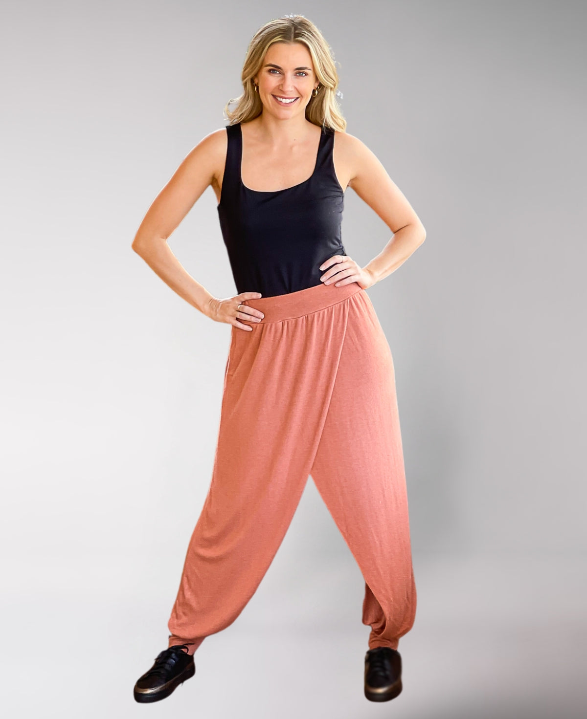 Copper Aladina Knit Harem Pants with a flowy silhouette, designed with a ribbed waistband and soft knit fabric for ultimate comfort.