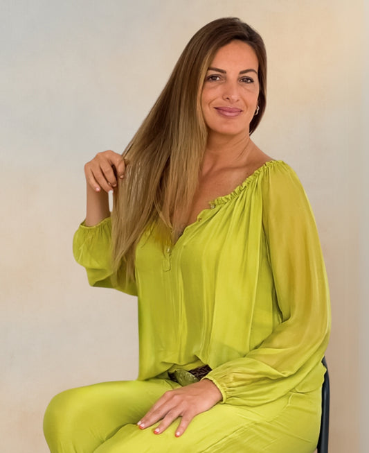 Vibrant chartreuse silk top with a breezy, off-shoulder option and boho-inspired elegance, perfect for effortless summer styling.