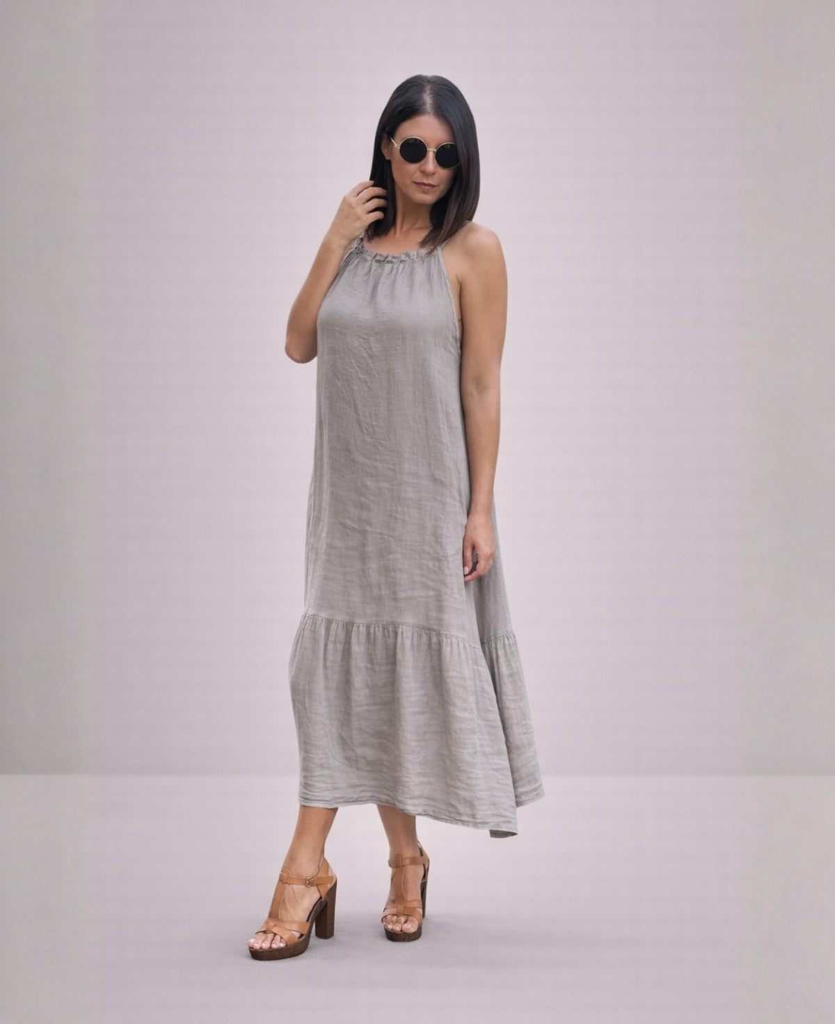 Front angled view of the Cassey linen dress in taupe, highlighting soft linen texture, relaxed fit and everyday wearability.