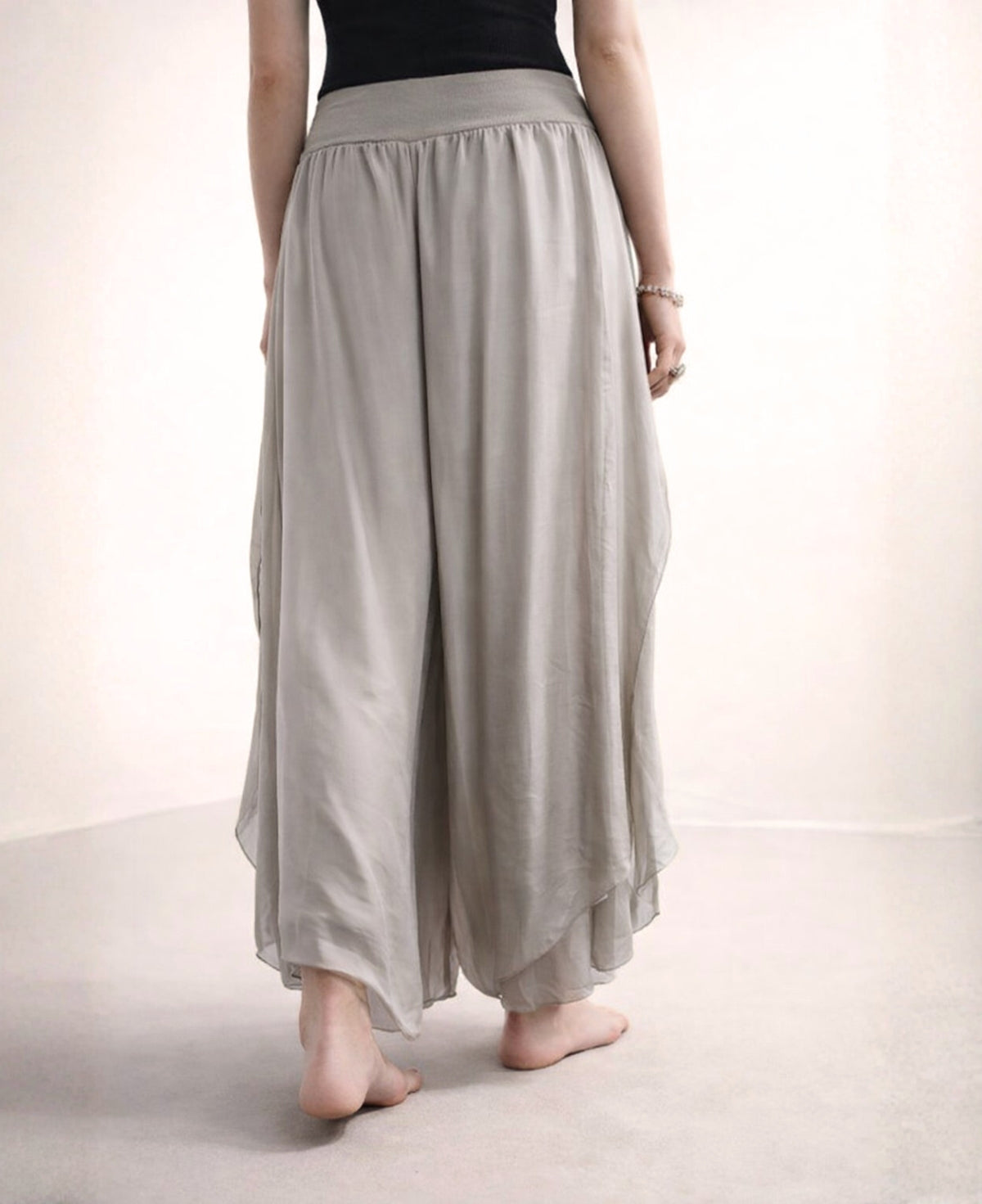 Back view of the mocka Celine Silk Blend Boho Pants, featuring a graceful drape of fluid silk blend fabric and refined boho detailing.