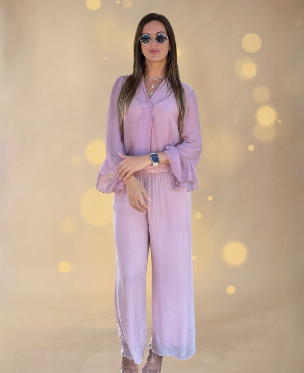 Silk blend Cora pants in soft rose, featuring wide straight legs and a flowing, elegant silhouette.