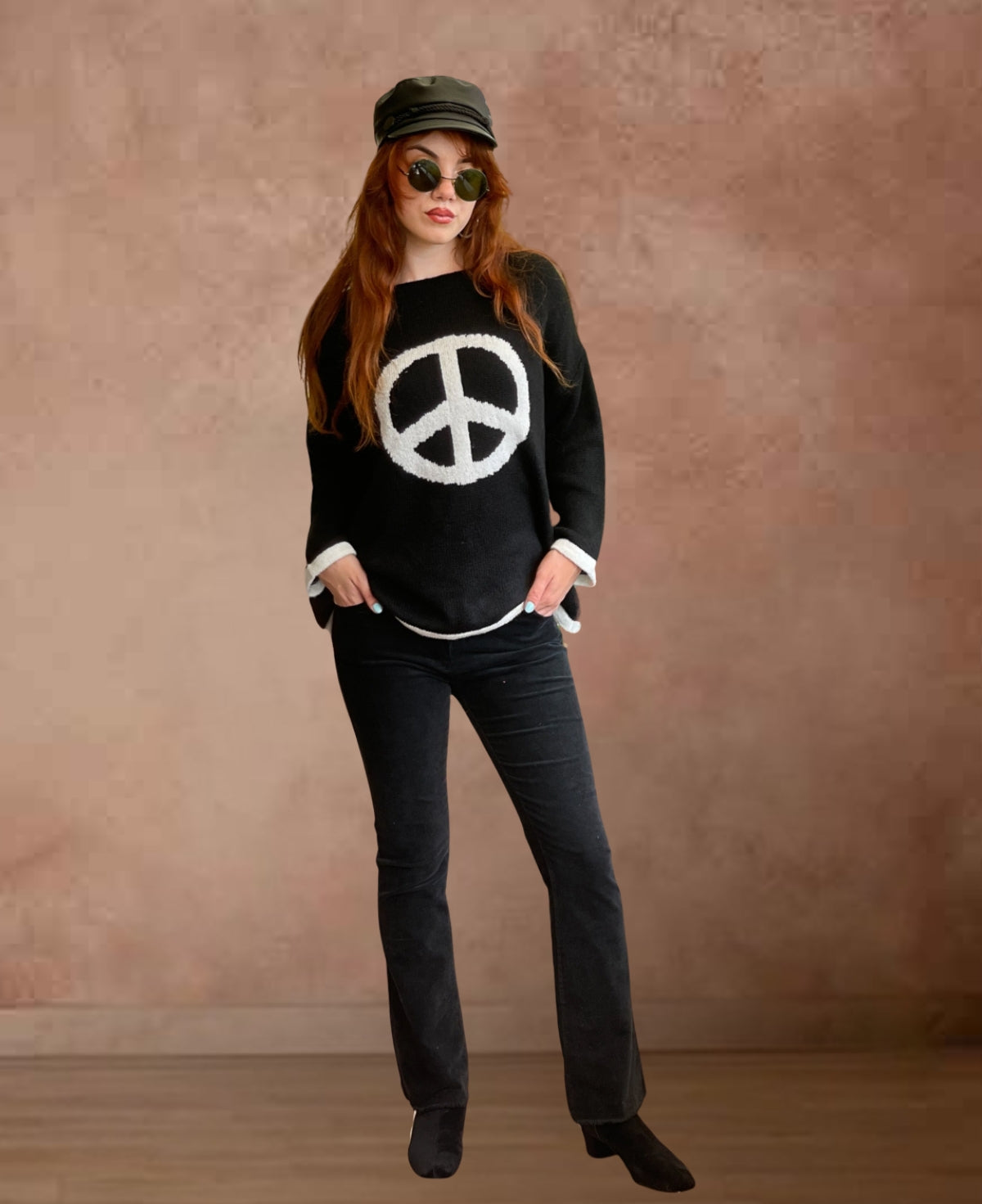 Front view of black straight-leg corduroy jeans featuring exquisite fine ribbing and subtly frayed hems for a contemporary, fashion-forward look.