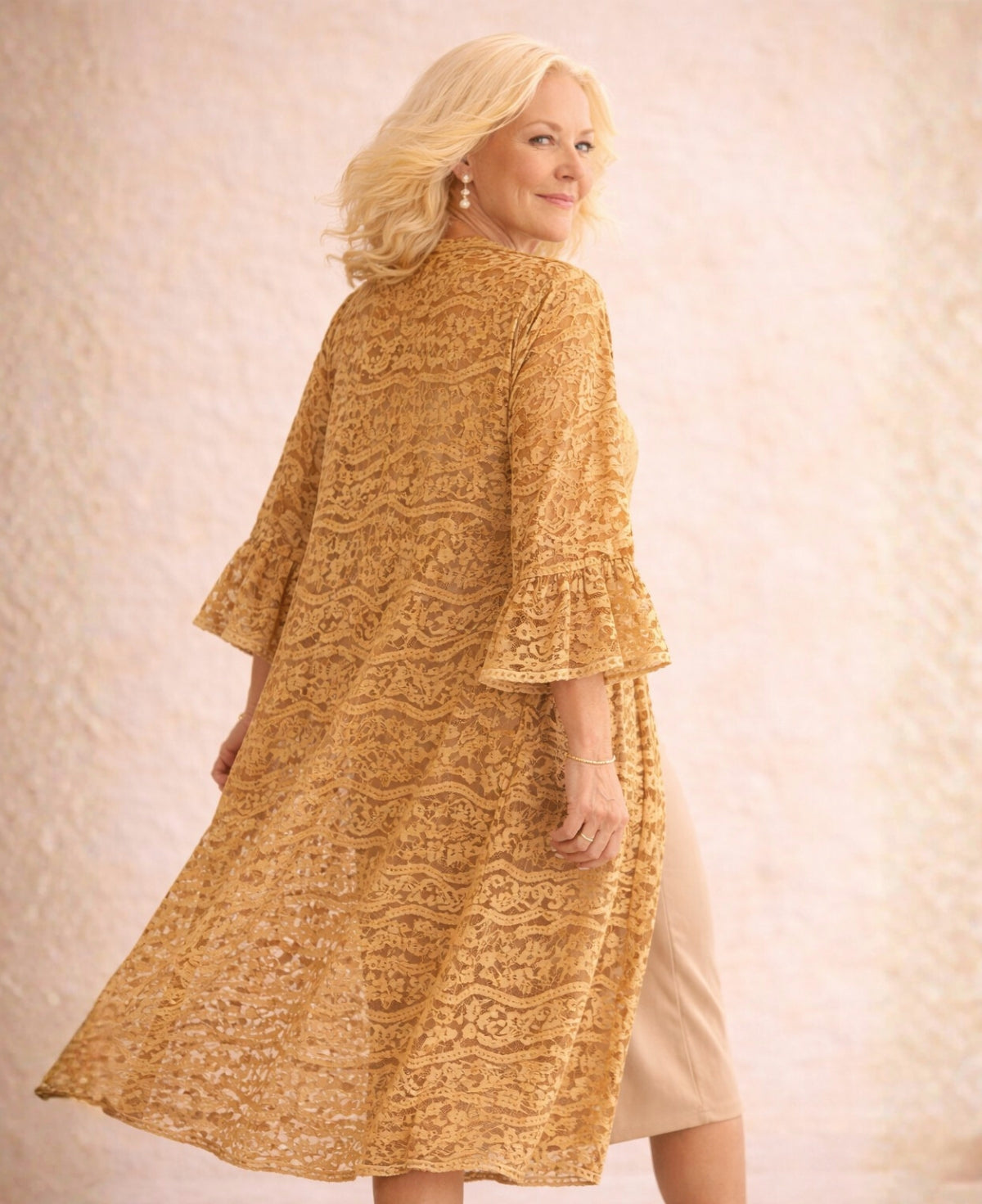 Back angled view of the Daniella Lace Kimono in Caramel showing the A-line drape, full lace pattern and soft fluted sleeve detail.