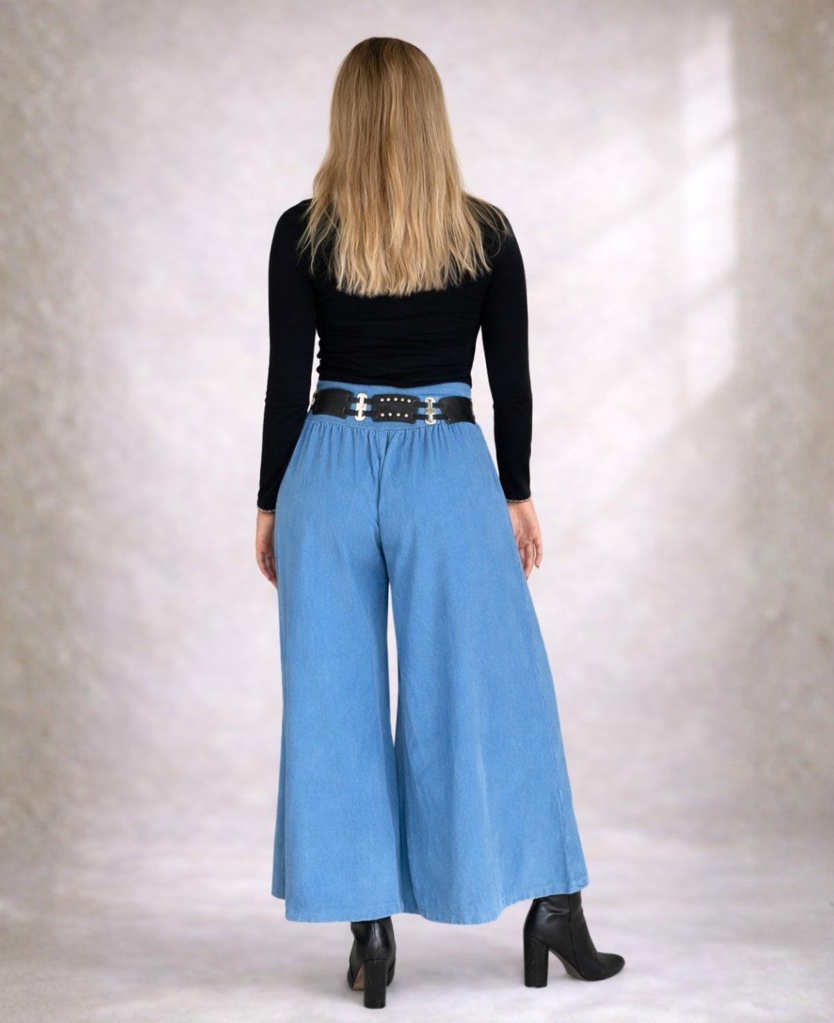 Back view of Demi Corduroy Pants in Blue Heaven with elastic waist and relaxed wide-leg shape.