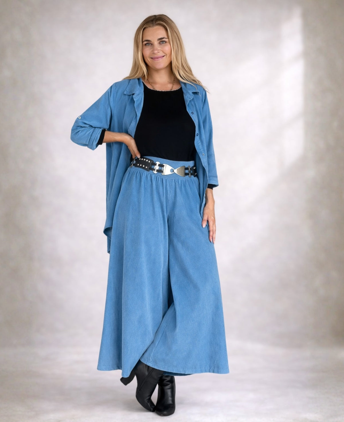 Front angled view of Demi Corduroy Pants in Blue Heaven showing wide-leg fit and fine ribbed corduroy texture.