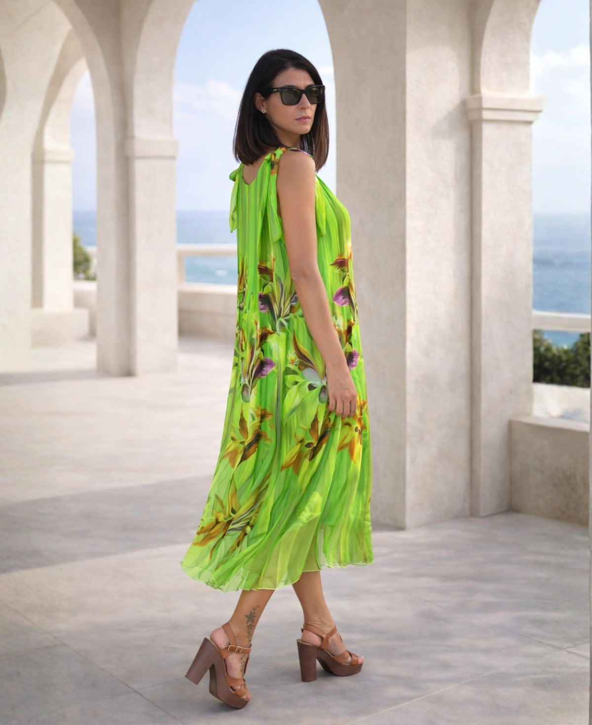 Side view of Dior Silk Dress in emerald green floral silk, highlighting airy fabric, elegant drape, and relaxed silhouette