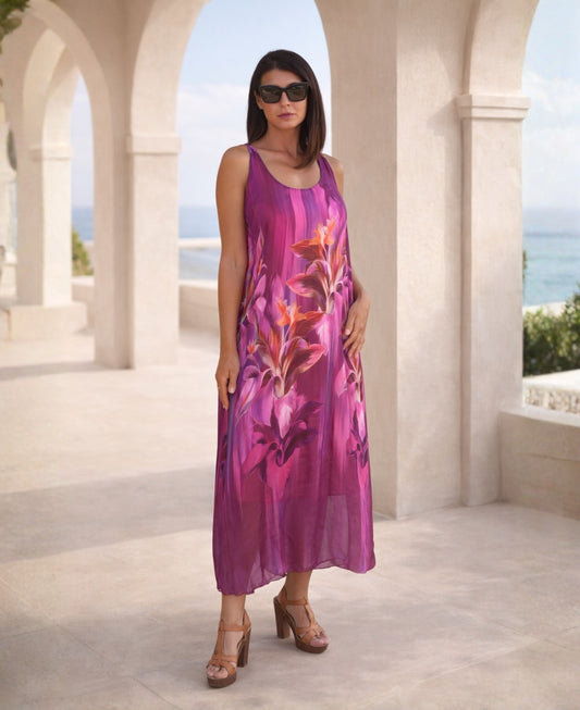 Dior Silk Dress in vibrant sangria color floral print, front view, flowing silk midi dress styled in a Mediterranean architectural setting