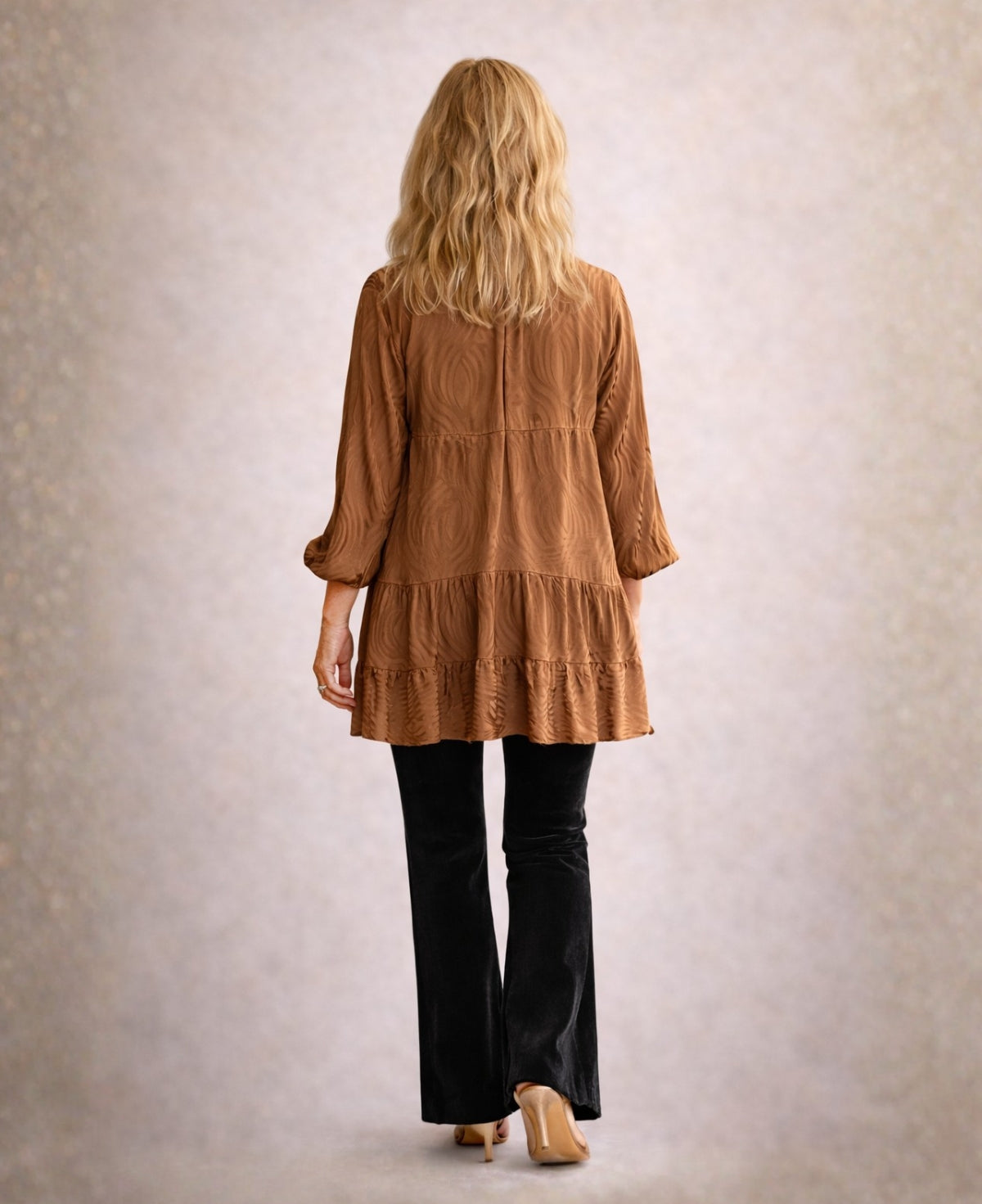 Back view of the copper Eden Pattern satin top showing tiered design and softly textured satin fabric.