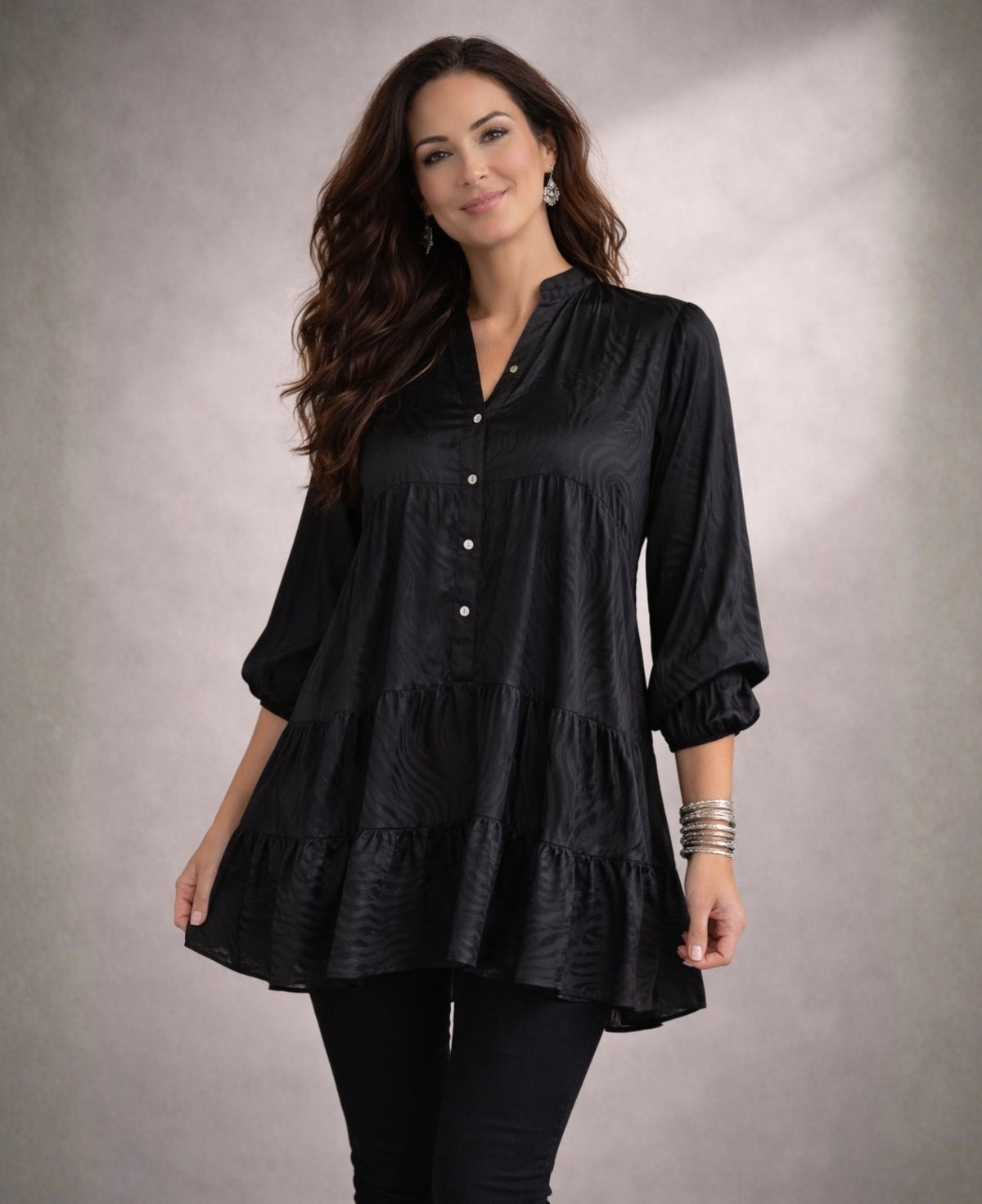 Editorial styling of the black Eden Pattern satin top mini dress showcasing soft sheen and textured satin pattern.
