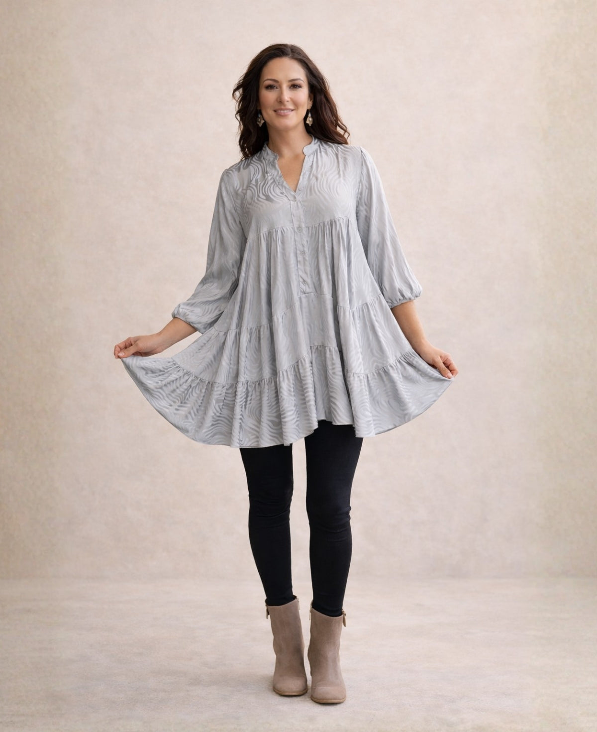 Full-length view of the silver Eden Pattern satin top mini dress showing puff sleeves, tiered silhouette and subtle embossed satin pattern.