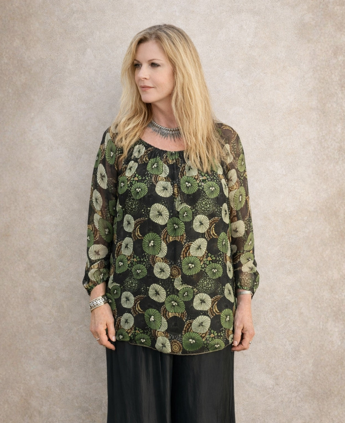 Front view of the Fern Silk Blouse in sheer silk with green botanical pattern, loose silhouette and soft drape on the body