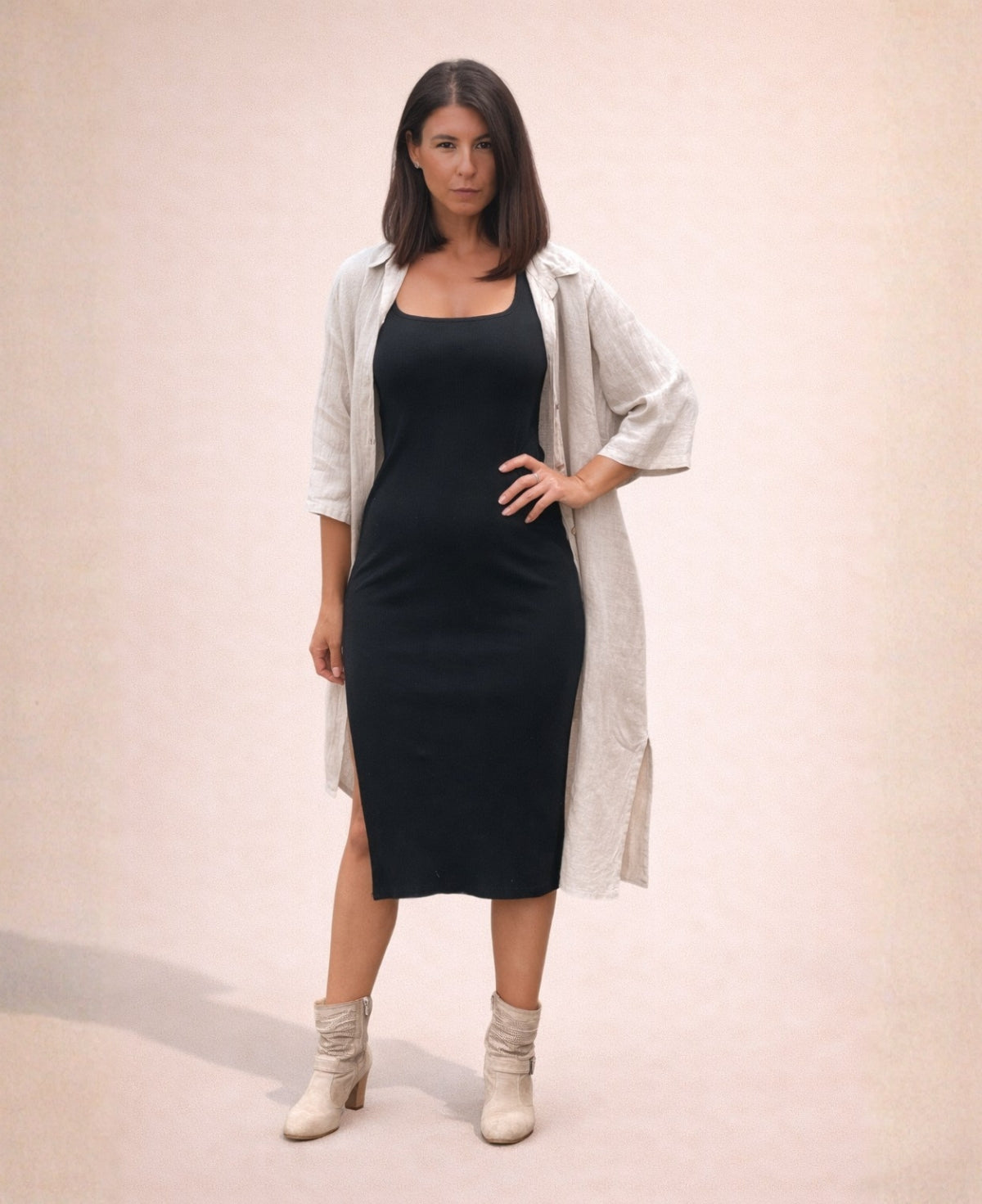 Black ribbed cotton jersey Hollywood Dress styled with an open linen shirt for relaxed layered look on minimalist studio background