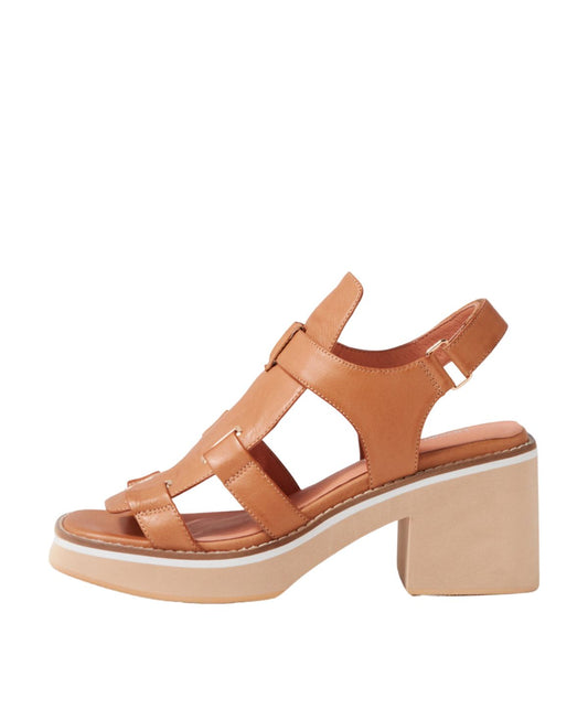 Tan leather heeled sandals with a square toe and modern cage design, side profile showcasing block heel and sleek silhouette.
