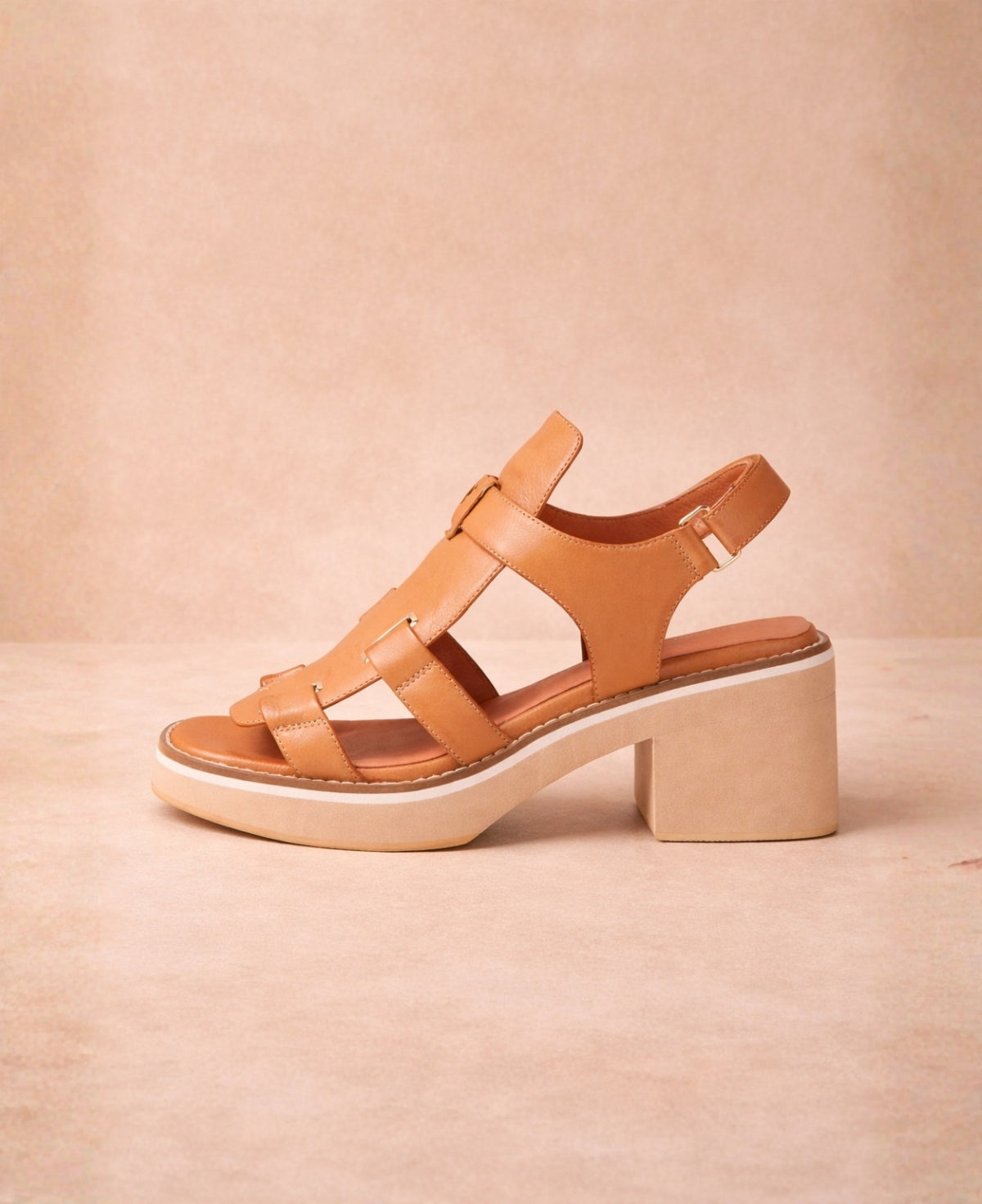Side view of Jennis tan leather sandals highlighting the block heel and layered sole