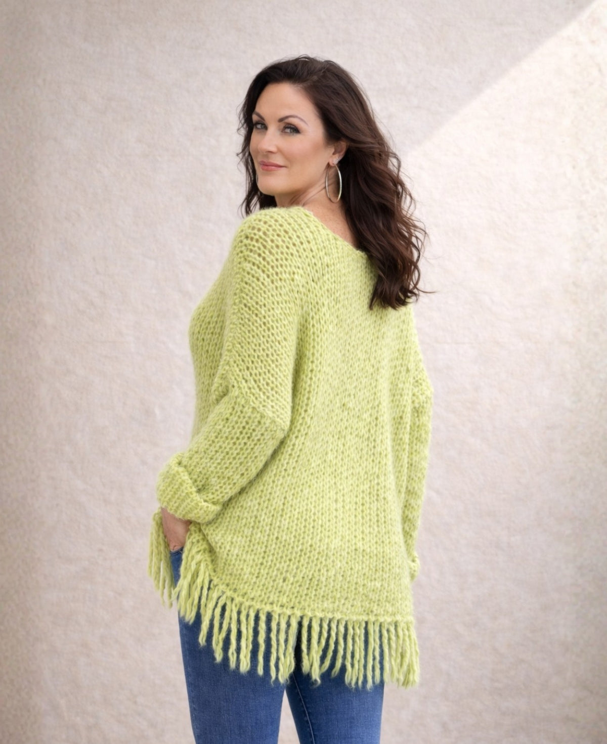 Back angled view of lime mohair blend jumper showing loose knit texture and relaxed drape