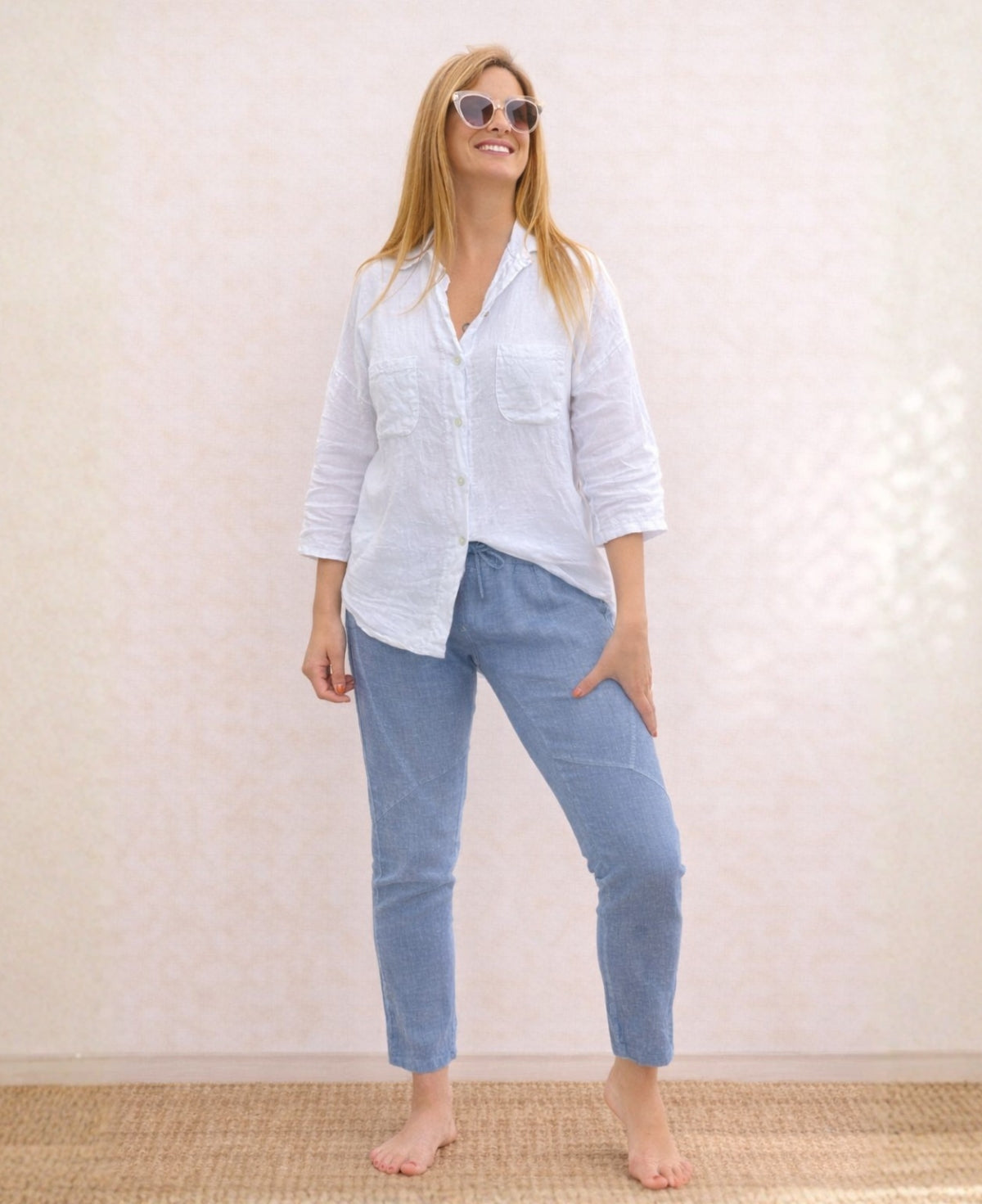 Full body front view of the Jordan Linen Pants in denim blue with narrow leg cut and front seam detailing.