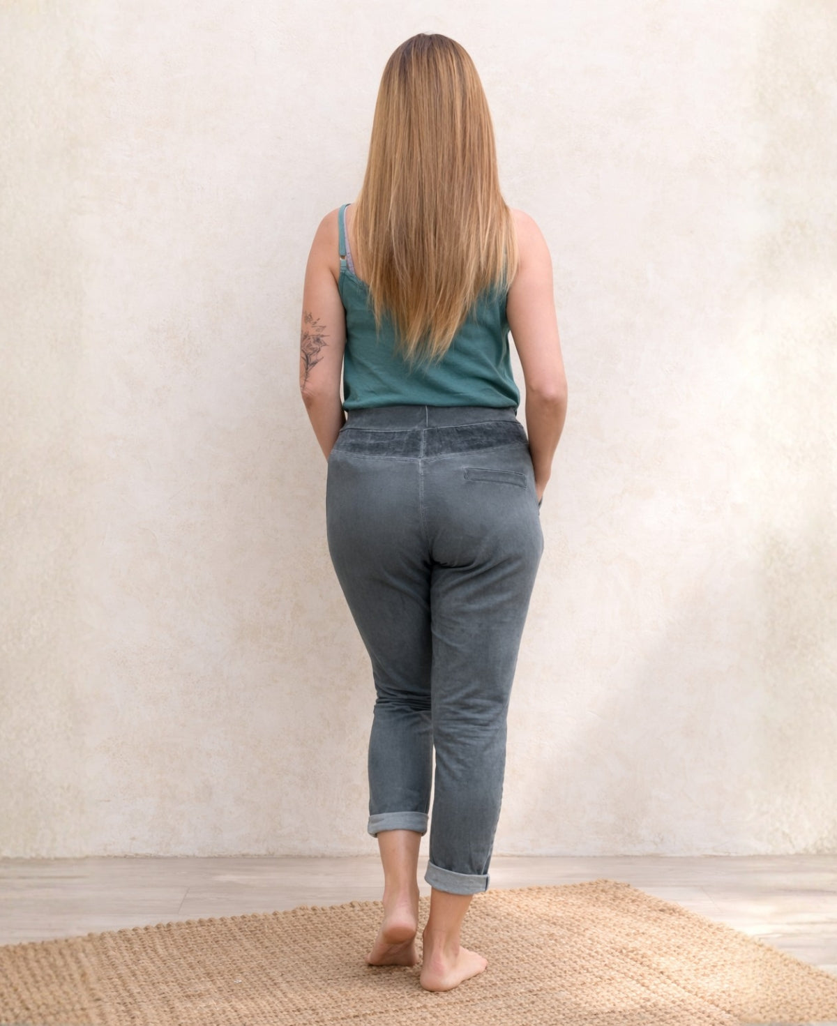 Full body back view of the Jordan Linen Pants in grey highlighting the soft jersey back and slim fit silhouette.