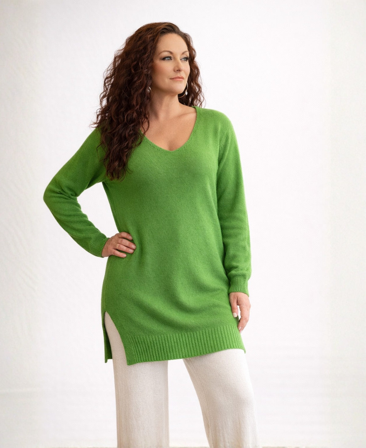 Apple green long cashmere sweater with V-neck and ribbed hem, front view