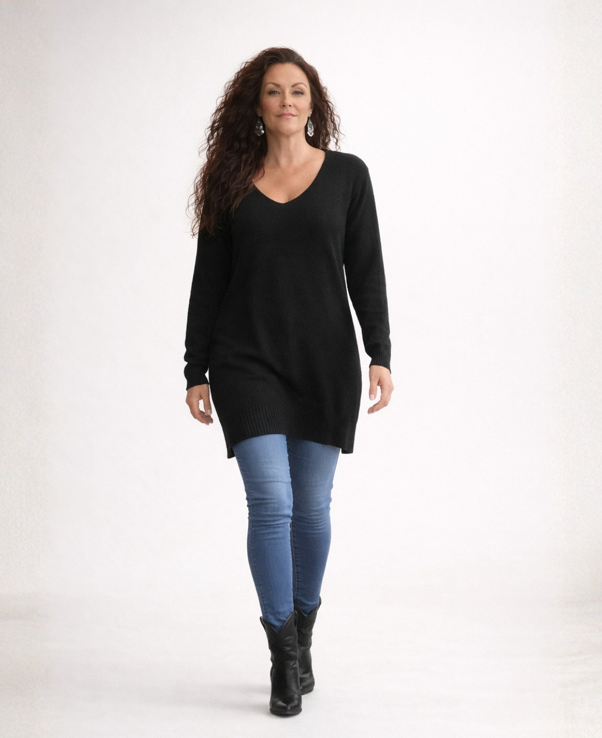 Full length black cashmere sweater showing relaxed fit and longline silhouette