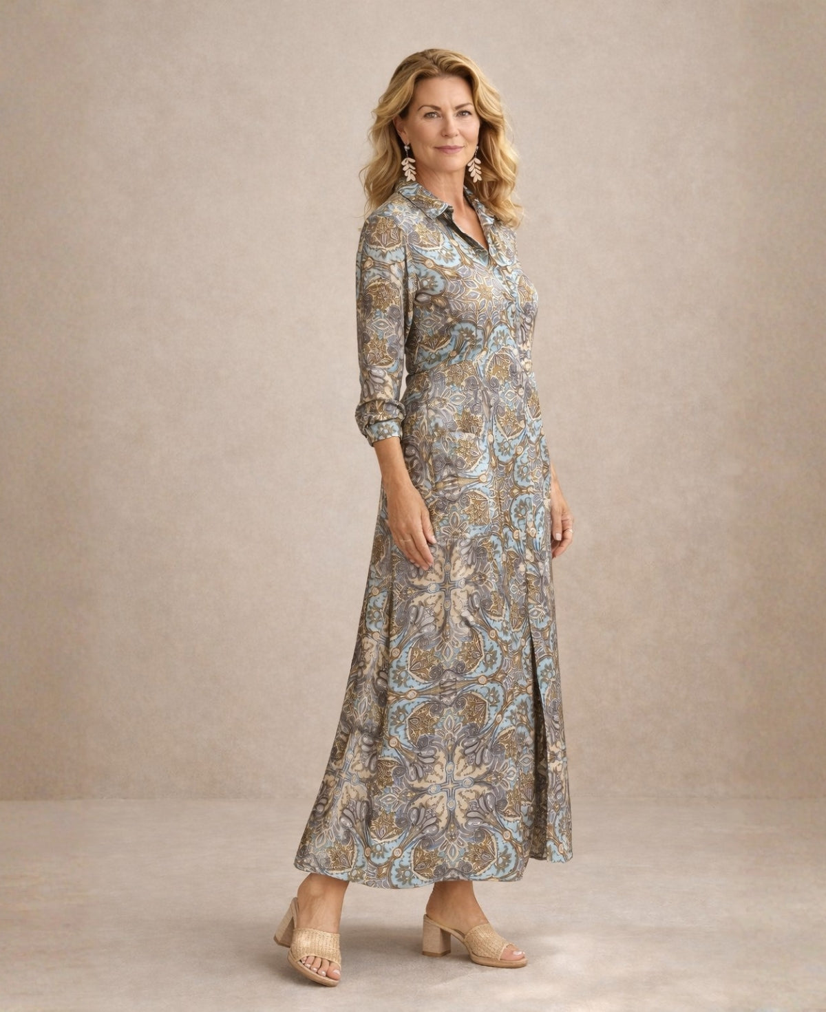 Three-quarter view of the Lilly printed silk maxi dress showing shaped waistline, soft drape through hips and full-length flowing skirt in detailed paisley Indian silk.