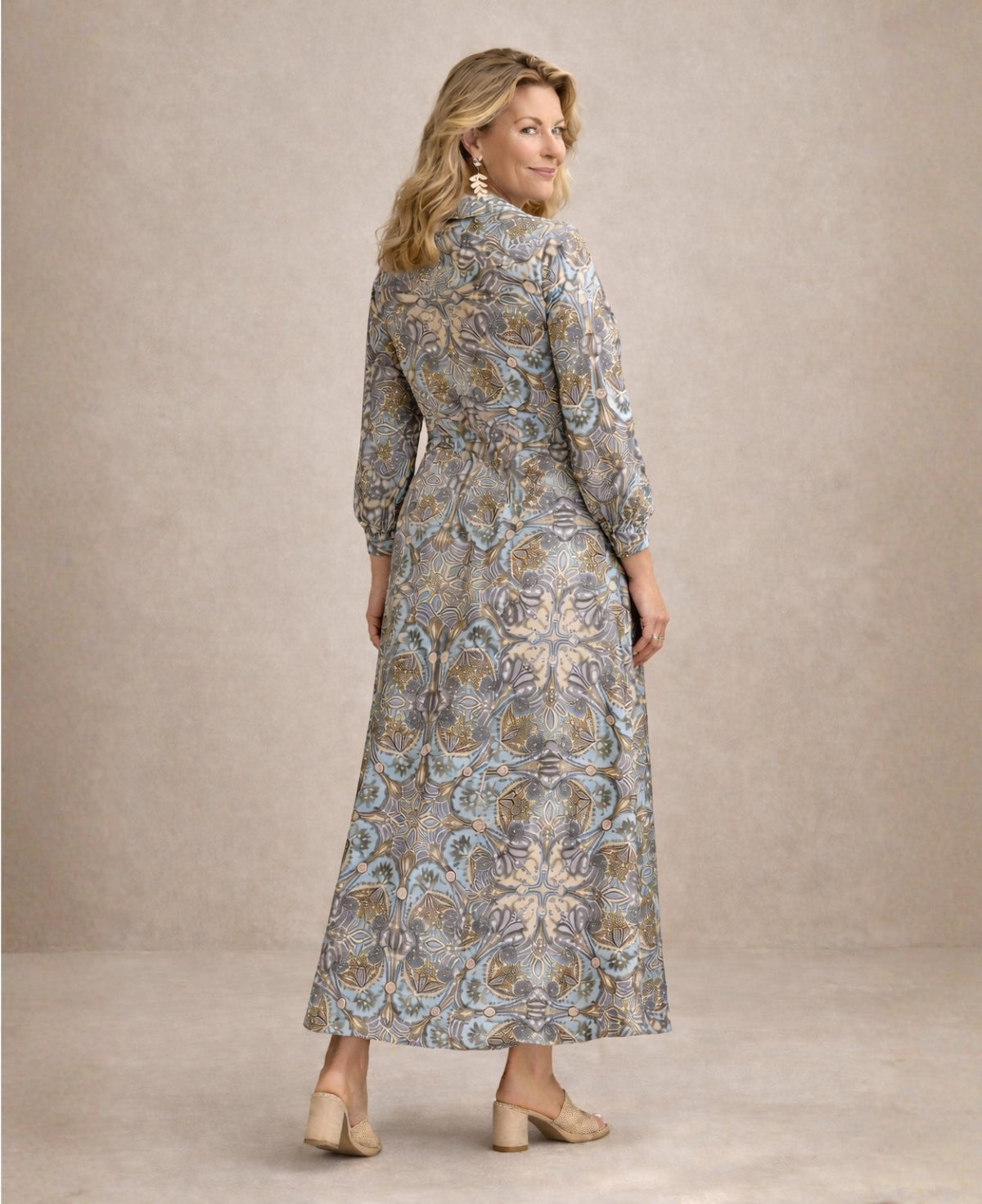 Back view of the Lilly Indian silk shirt dress with tailored waist, long balloon sleeves with cuffs and fluid maxi-length silhouette, ideal as a women’s statement occasion dress.