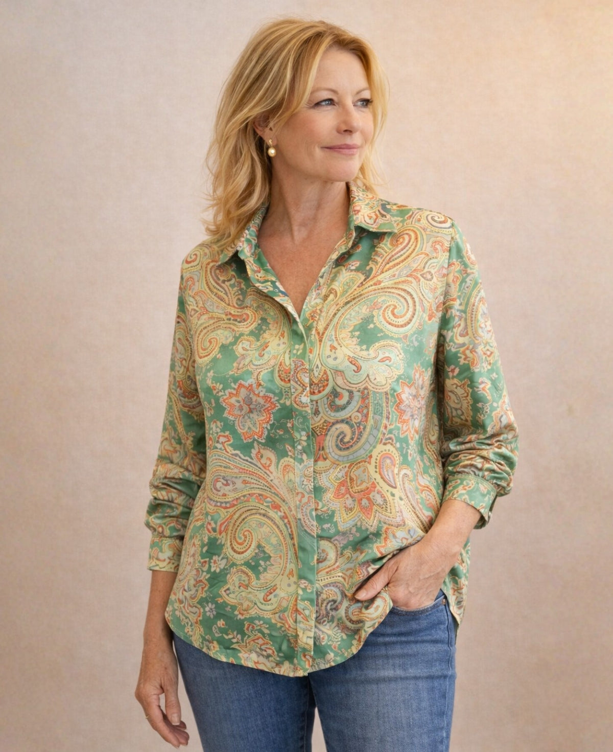 Three quarter front view of Lotus Silk Shirt in green paisley with soft collar and relaxed silhouette