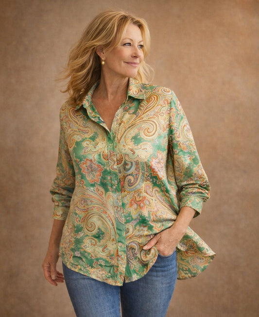 Editorial image of Lotus Silk Shirt in green paisley satin silk highlighting fluid movement and loose fit