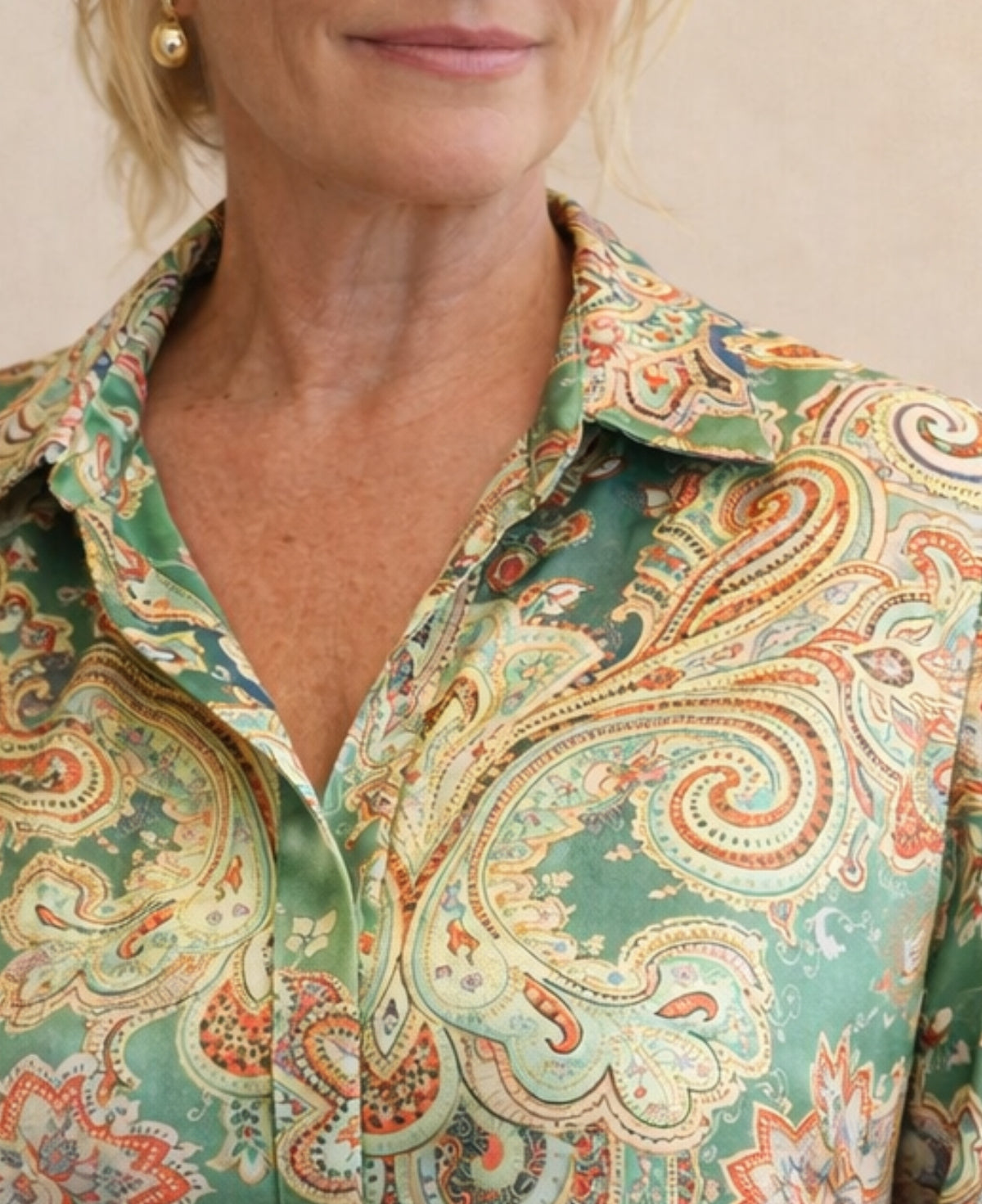 Close-up of Lotus Silk Shirt in green paisley Indian satin silk showing soft collar and hidden placket detail
