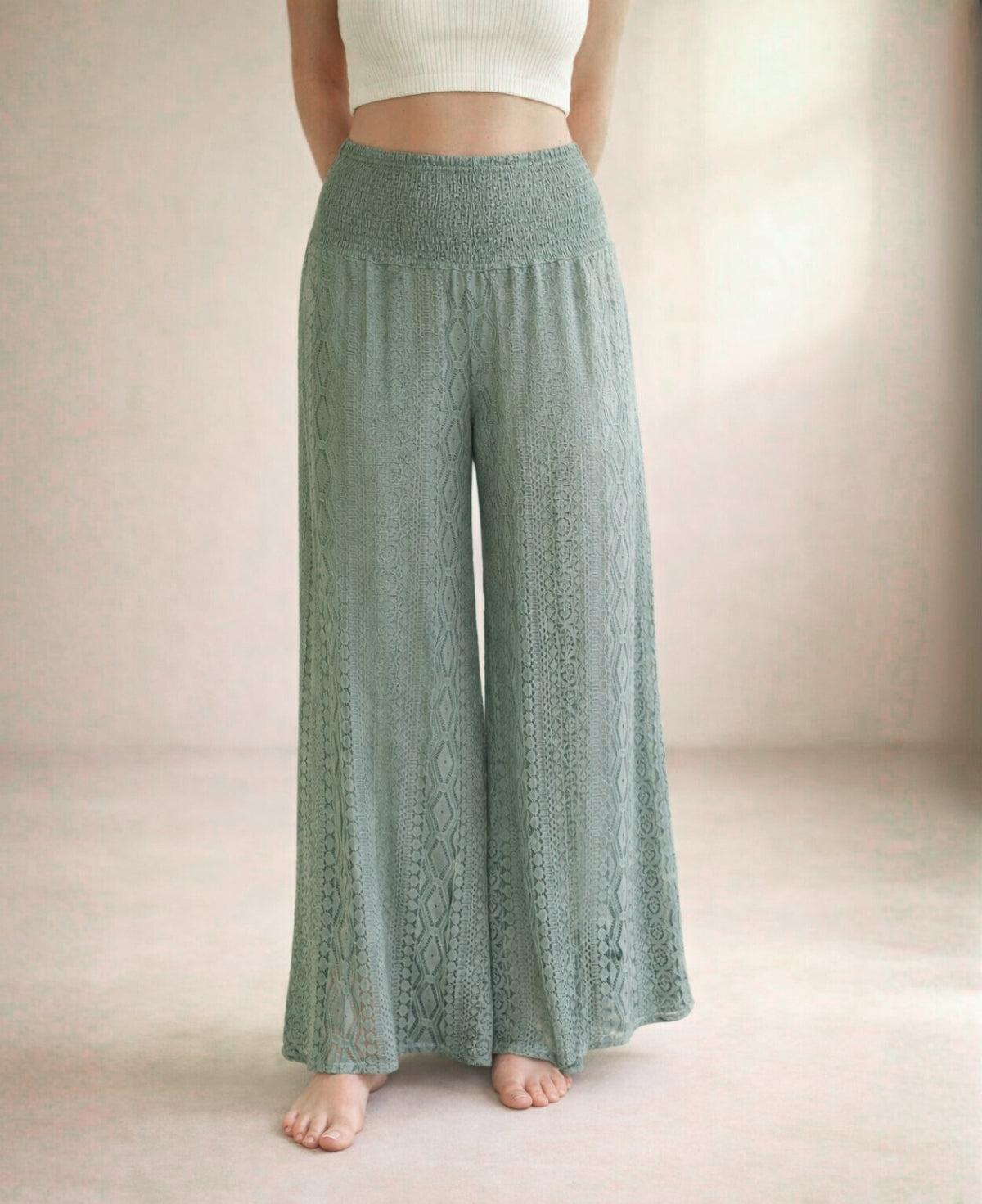 Close view of Louella Boho Lace Pants in Khaki showing shirred waistband and wide lace legs in soft studio lighting.