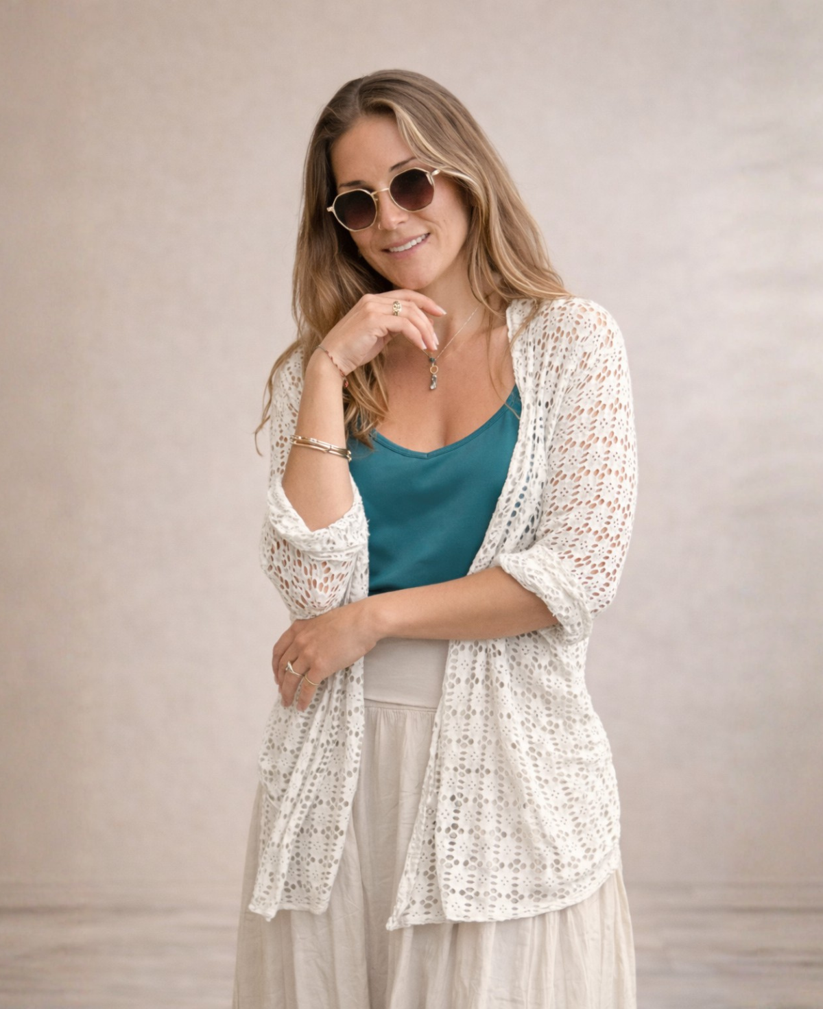 Three quarter studio shot of Louella Lace Cardi in Beige highlighting open lace detail and soft movement.