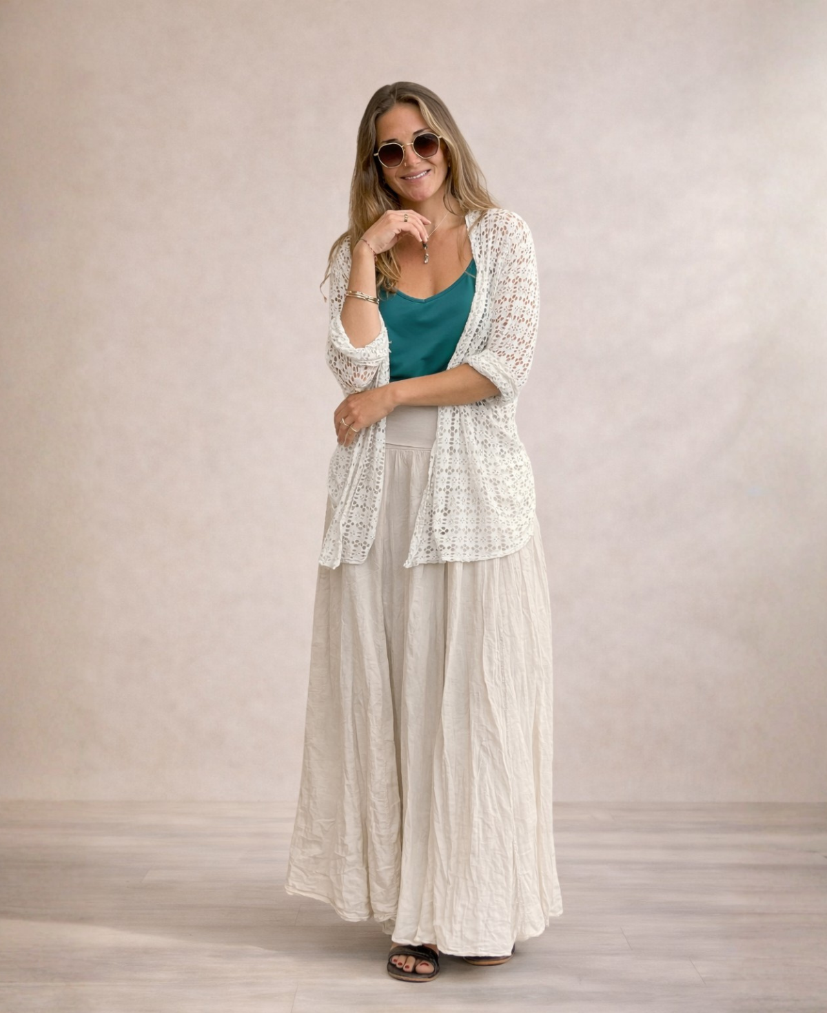 Full body image of Louella Lace Cardi in Beige layered over matching lace top and pants in studio setting.