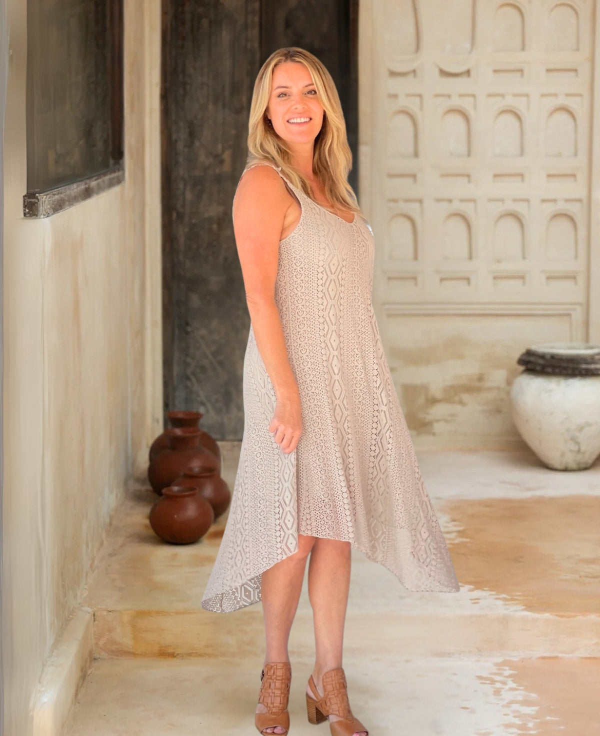 Close-up of beige Louella Boho Lace Dress, highlighting delicate crochet lace patterns and a flowy A-line silhouette for effortless boho charm.