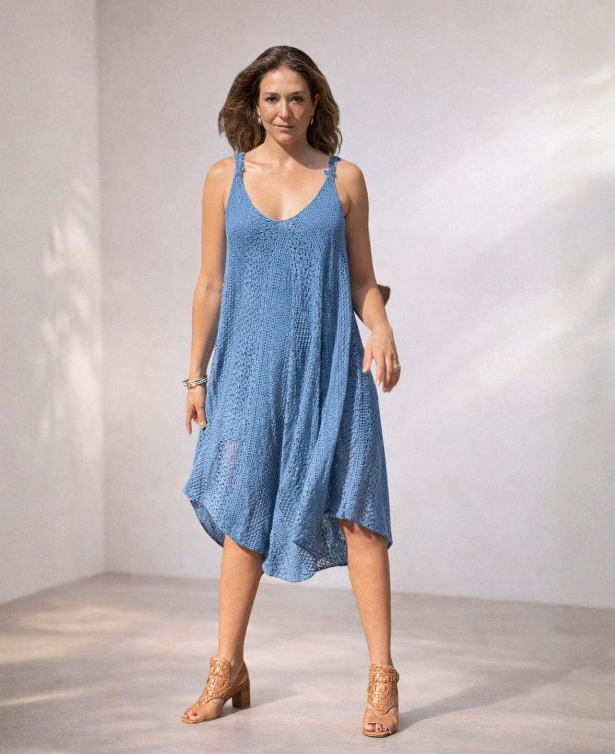 Front view of Louella Swing Lace Dress in Jeans blue lace with swing silhouette and asymmetrical hem.