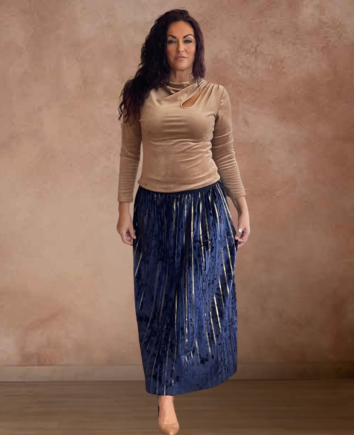 Navy Nikita Velour Skirt with gold vertical stripes, featuring a soft elastic waistband for a flattering fit.