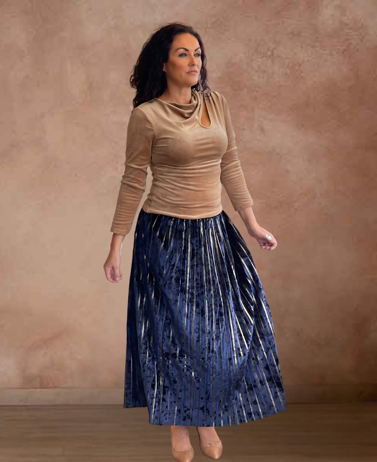 Luxurious navy velour skirt with shimmering gold stripes, an elegant choice for day or night.