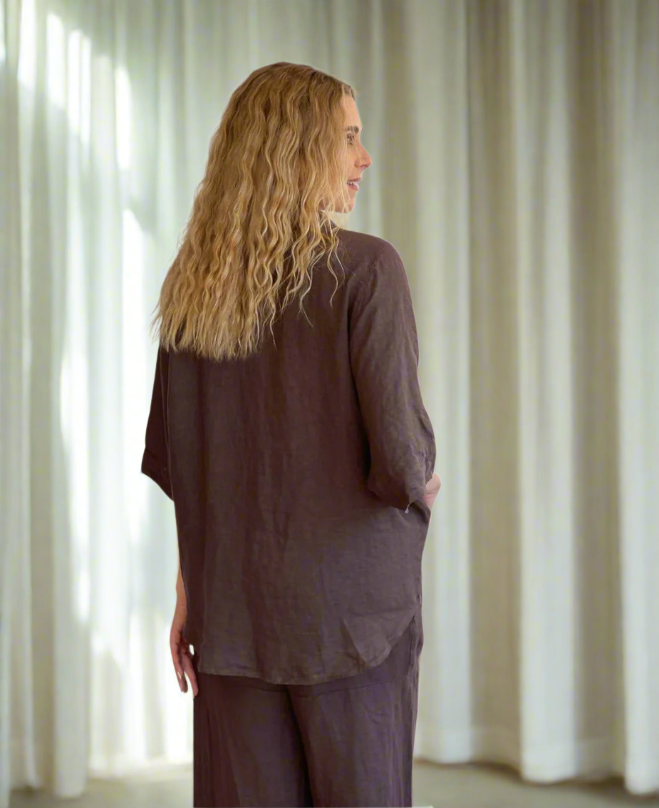 Back view of a dark chocolate linen kimono jacket, featuring a flowing silhouette perfect for breezy evenings