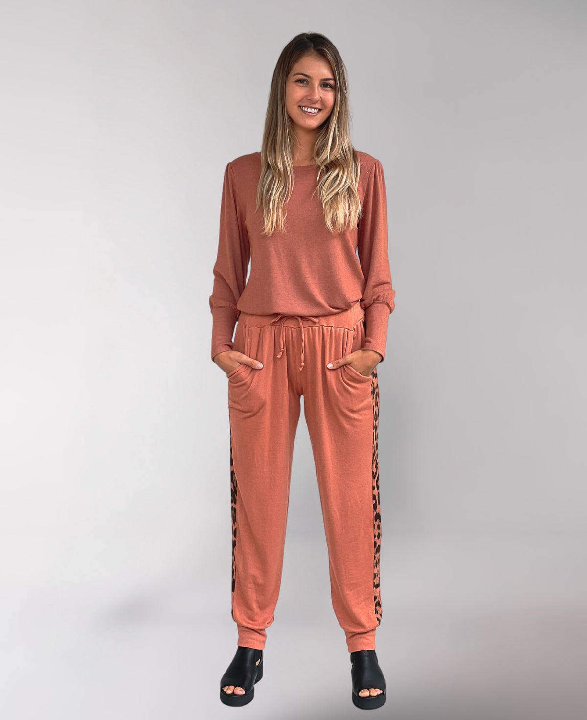 Full frontal view of Copper Paris Joggers showing tapered legs and cuffed hems