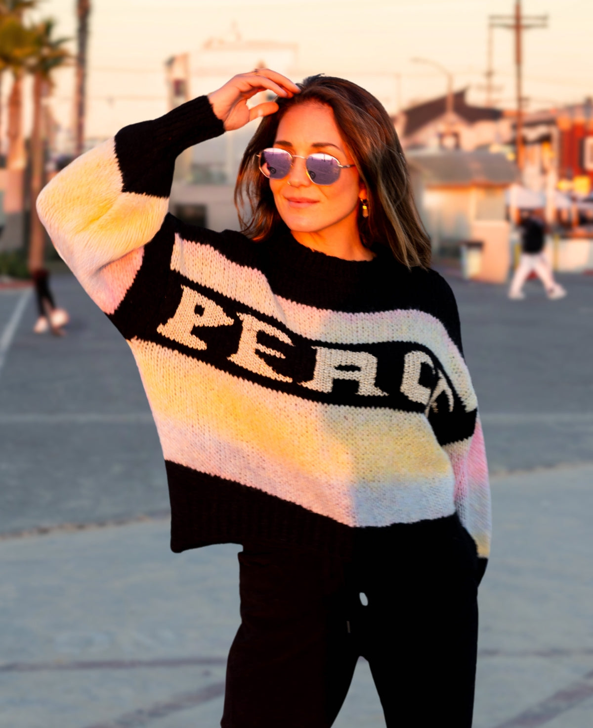 Frontal view of Black "Peace" Multi-Striped Sweater with contrasting heathered stripes